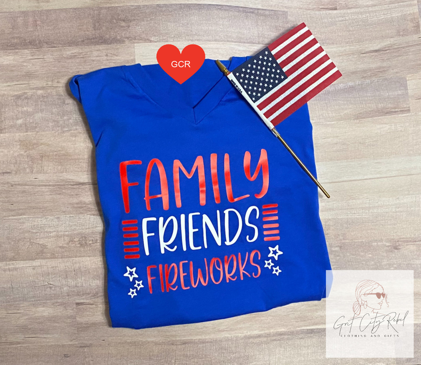 Blue short sleeve unisex T-Shirt with the saying of Family Friends Fireworks in red white and blue