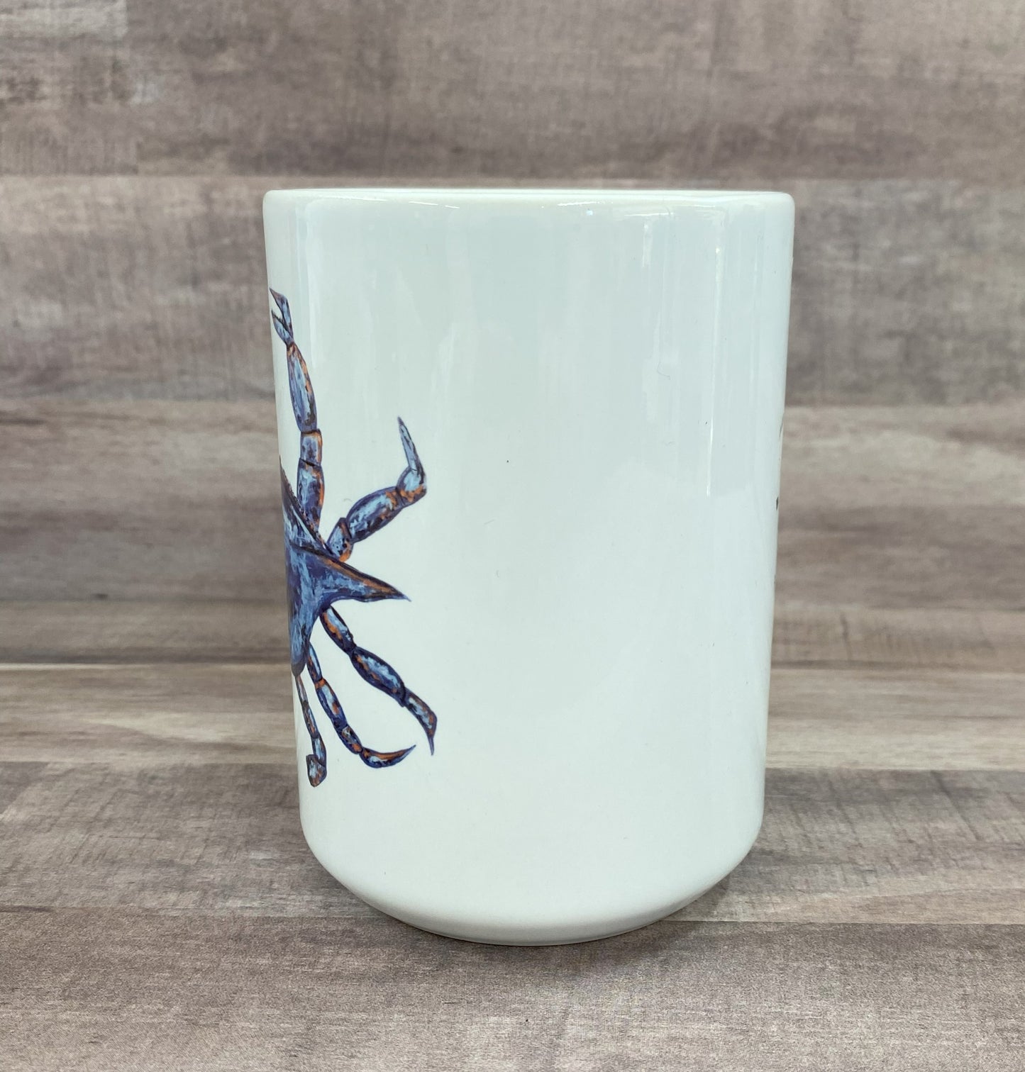 16oz ceramic mug with a blue watercolor image of a crab - grit city rebel