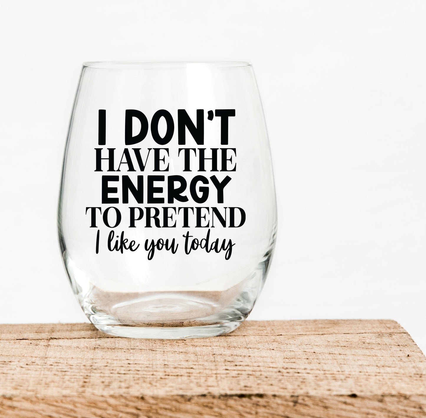 15oz Wine glass with the saying I don't have the energy to pretend I like you today in black writing Grit City Rebel