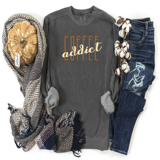 Dark Grey long sleeve sweatshirt with saying Coffee Addict in orange and cream