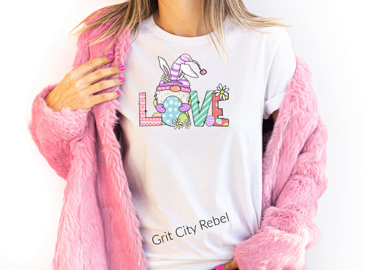 White short sleeve unisex fit T-Shirt with a bunny and the word Love all in multi colors of spring