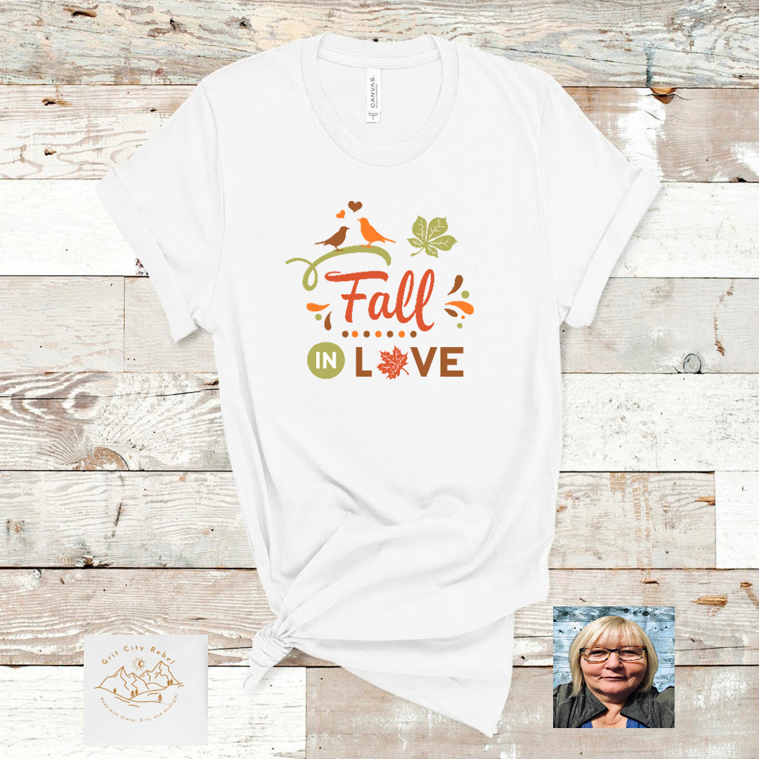 White TShirt with the saying Fall in Love in green and orange corols, Grit City Rebe