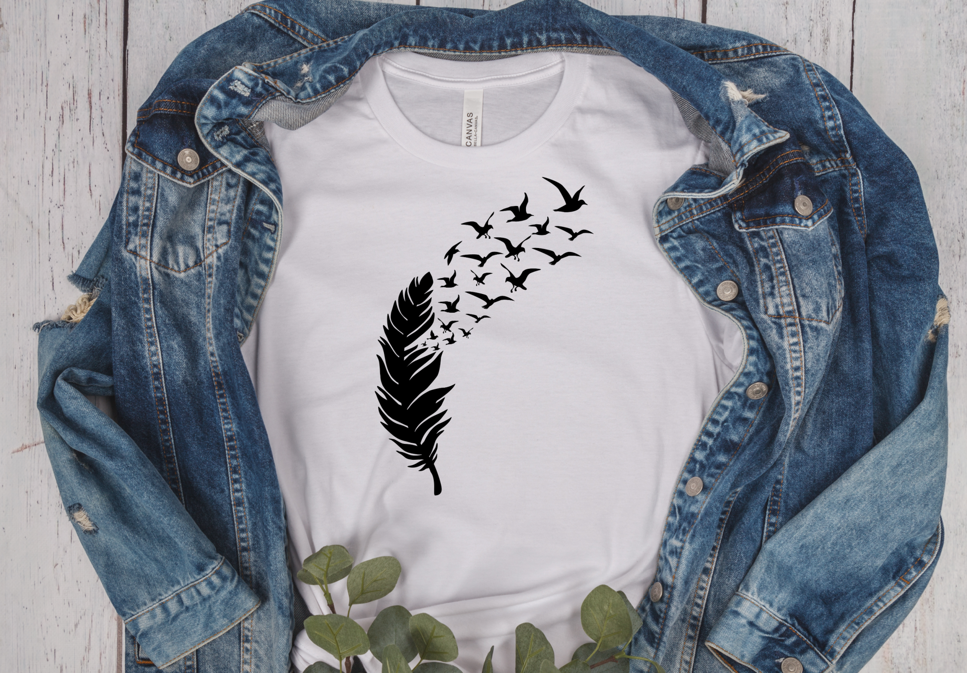 white unisex short sleeve T-Shirt with a black feather and birds flying out of it