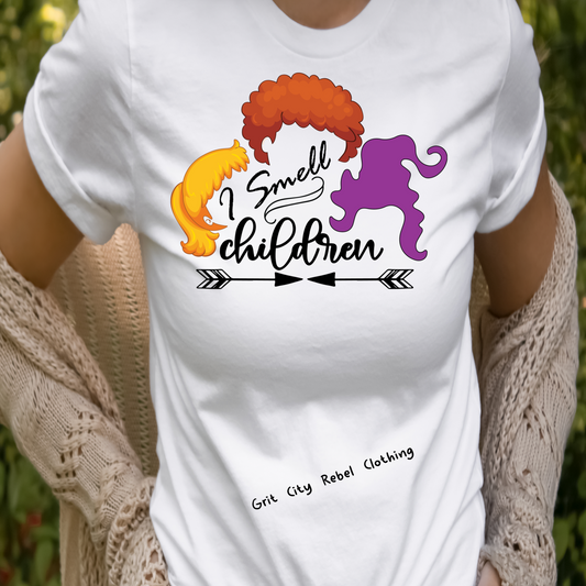 White unisex TShirt with the anderson sisters profile in colors and the saying I Smell Children in Black