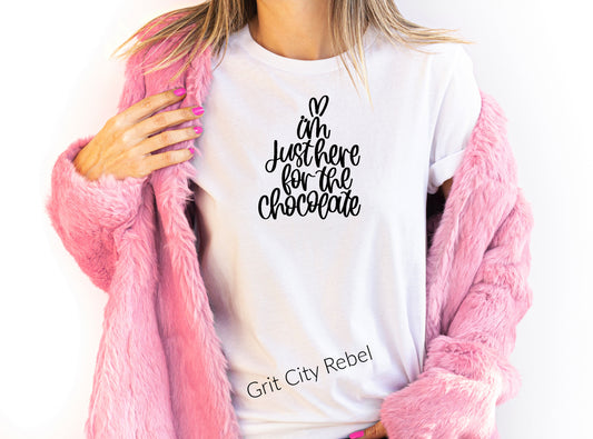 White short sleeve unisex TShirt with the saying I'm just here for the chocolate in black writting