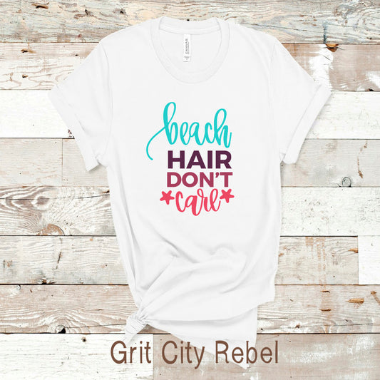 Grit City Rebel, White unisex T-Shirt with the saying Beach Hair D'ont Care written in teal black and pink,