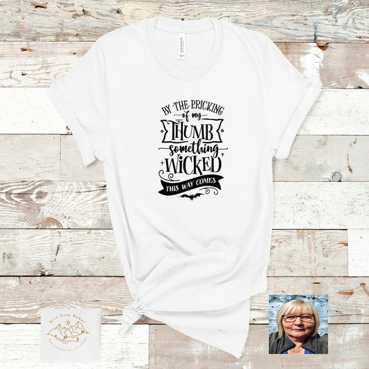 White unisex short sleeve Tshirt  with the saying By the pricking of my thumb something wicked this way comes