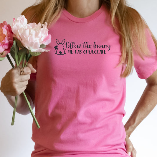 Pink TShirt with the saying follow the bunny He Has Cocolate writting in black