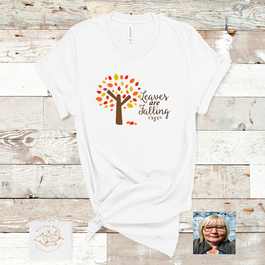 Tree with gold red and orange leaves and the saying Leaves are falling Grit City Rebel
