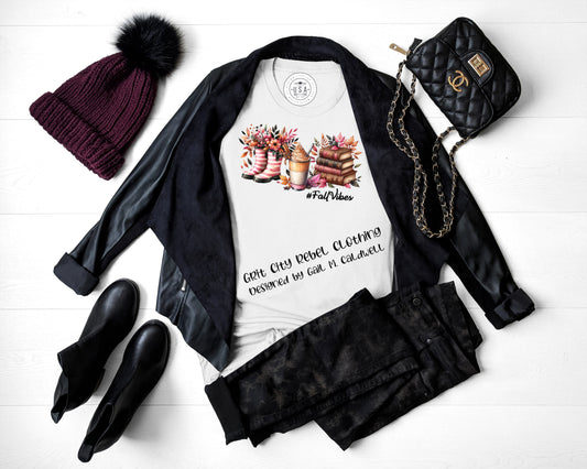 August 2025 VIP T-Shirt of the Month - Graphic of Rainboots with Flowers, a Beverage and a Stack of Books