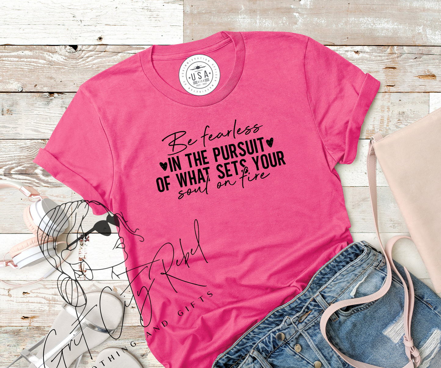 grit city rebel charity pink unisex t-shirt with the phrase be fearless in the pursuit of what sets your soul on fire in black vinyl. sizes small to 3xl