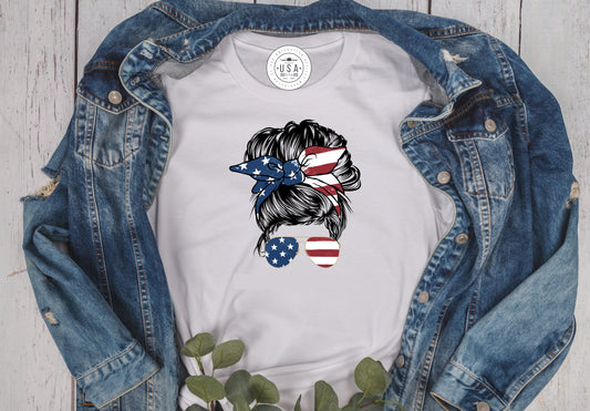 Grit city rebel unisex white t-shirt with a graphic of a women's head with a messy bun with a patriotic bandana and sunglasses. sizes small to 3xl