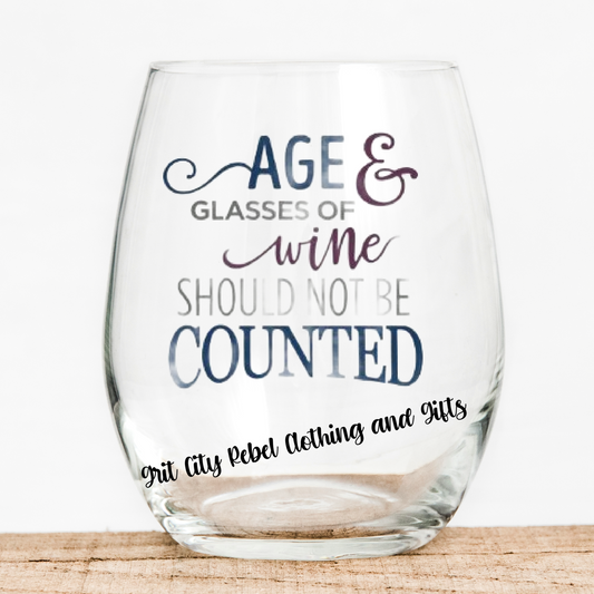 Age and wine should not be counted is a saying in muted colors using vinyl on a 15oz stemless wine glass. Grit City Rebel