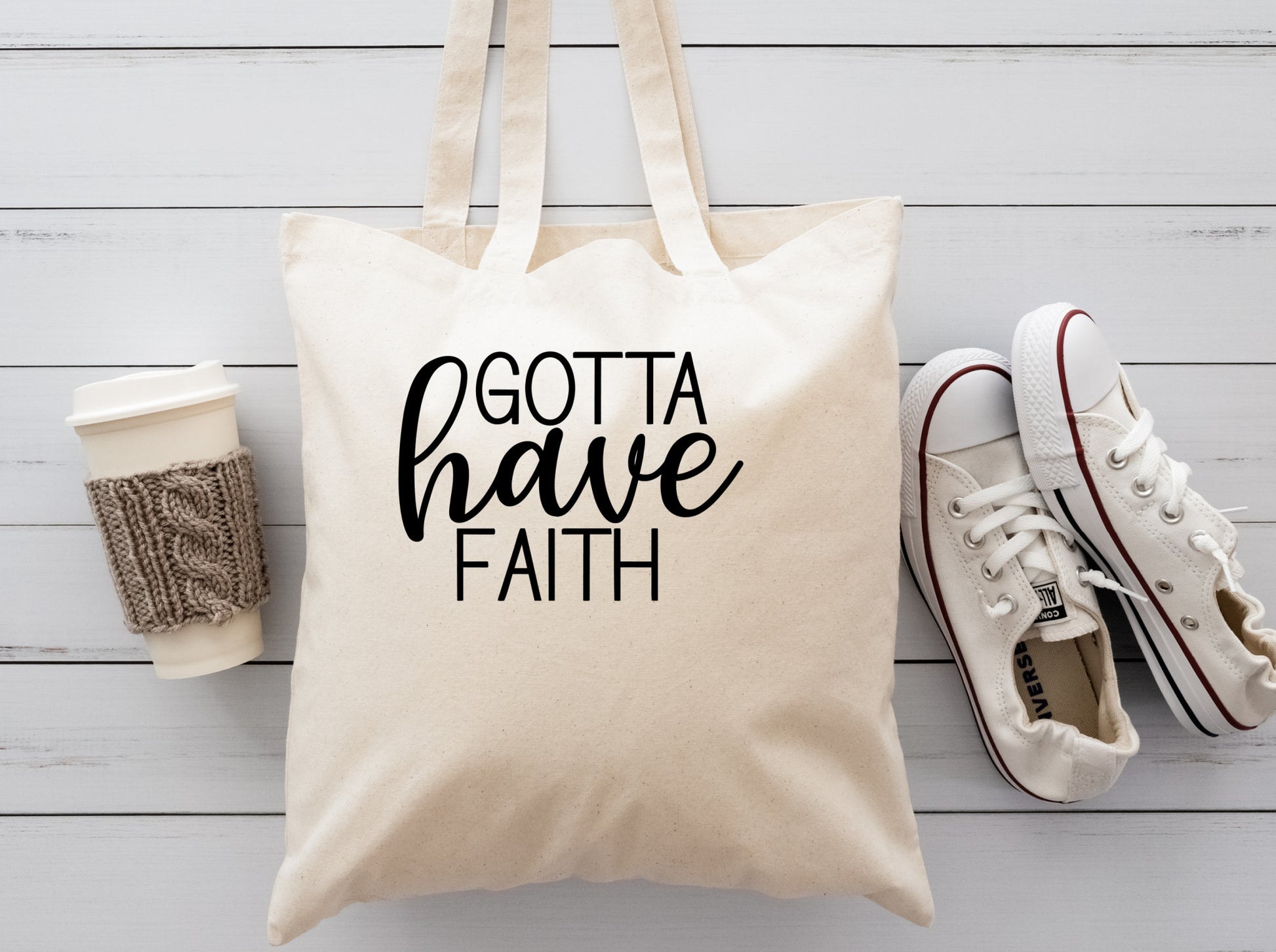 cream colored cloth reusable tote bag saying Gotta have Faith