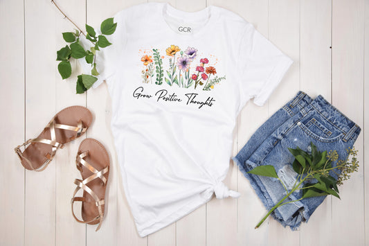 Grit City Rebel unisex fit white tshirt with wildflowers and the saying Grow Positive Thoughts in sizes Small to 3X