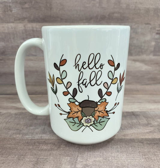 16oz ceramic mug with acorns and leaves with the saying hello fall - grit city rebel