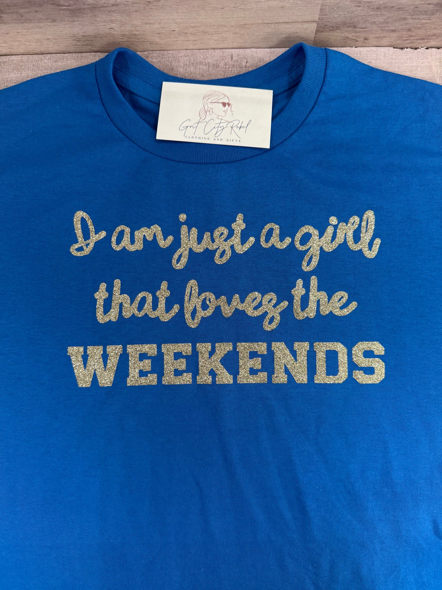 Just a Girl Who Loves Weekends phrase on a unisex short sleeve T-Shirt of the month. This is only a Tshirt not a subscription no free gifts added.