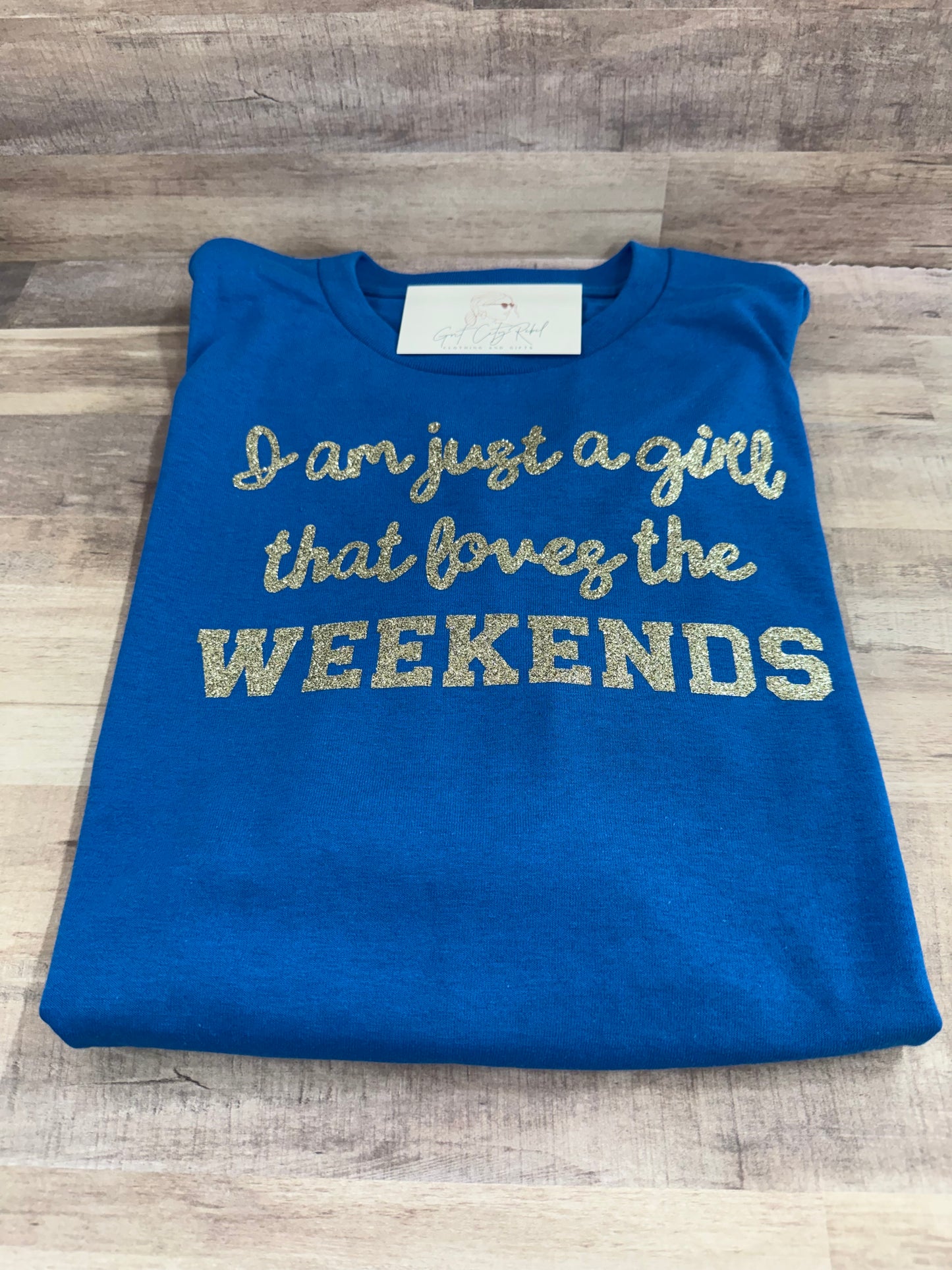 Just a Girl Who Loves Weekends phrase on a unisex short sleeve T-Shirt of the month. This is only a Tshirt not a subscription no free gifts added.