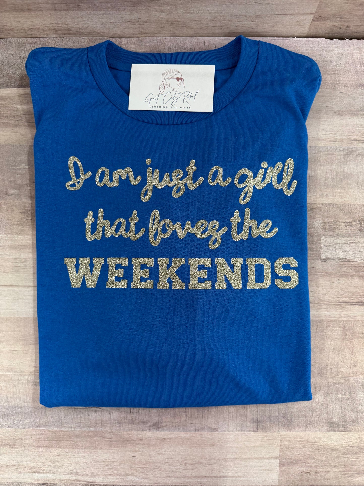 Just a Girl Who Loves Weekends phrase on a unisex short sleeve T-Shirt of the month. This is only a Tshirt not a subscription no free gifts added.