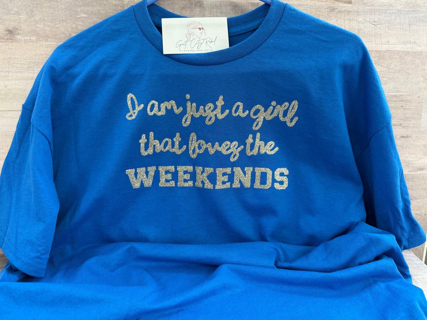 Just a Girl Who Loves Weekends phrase on a unisex short sleeve T-Shirt of the month. This is only a Tshirt not a subscription no free gifts added.