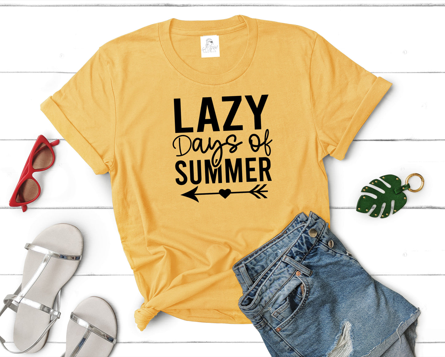 Grit City Revel unisex daisy gold t-shirt with the phrase Lazy days of summer. Available in sizes small to 3xl