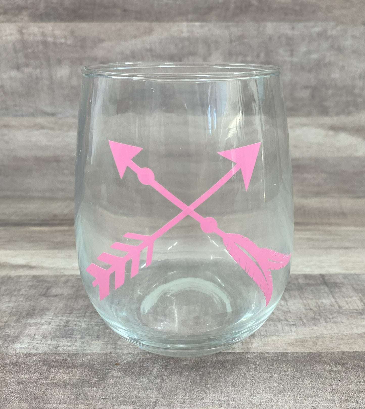 Stemless 15oz wine glass with pink crossed arrows Customizable. Designed by Grit City Rebel.