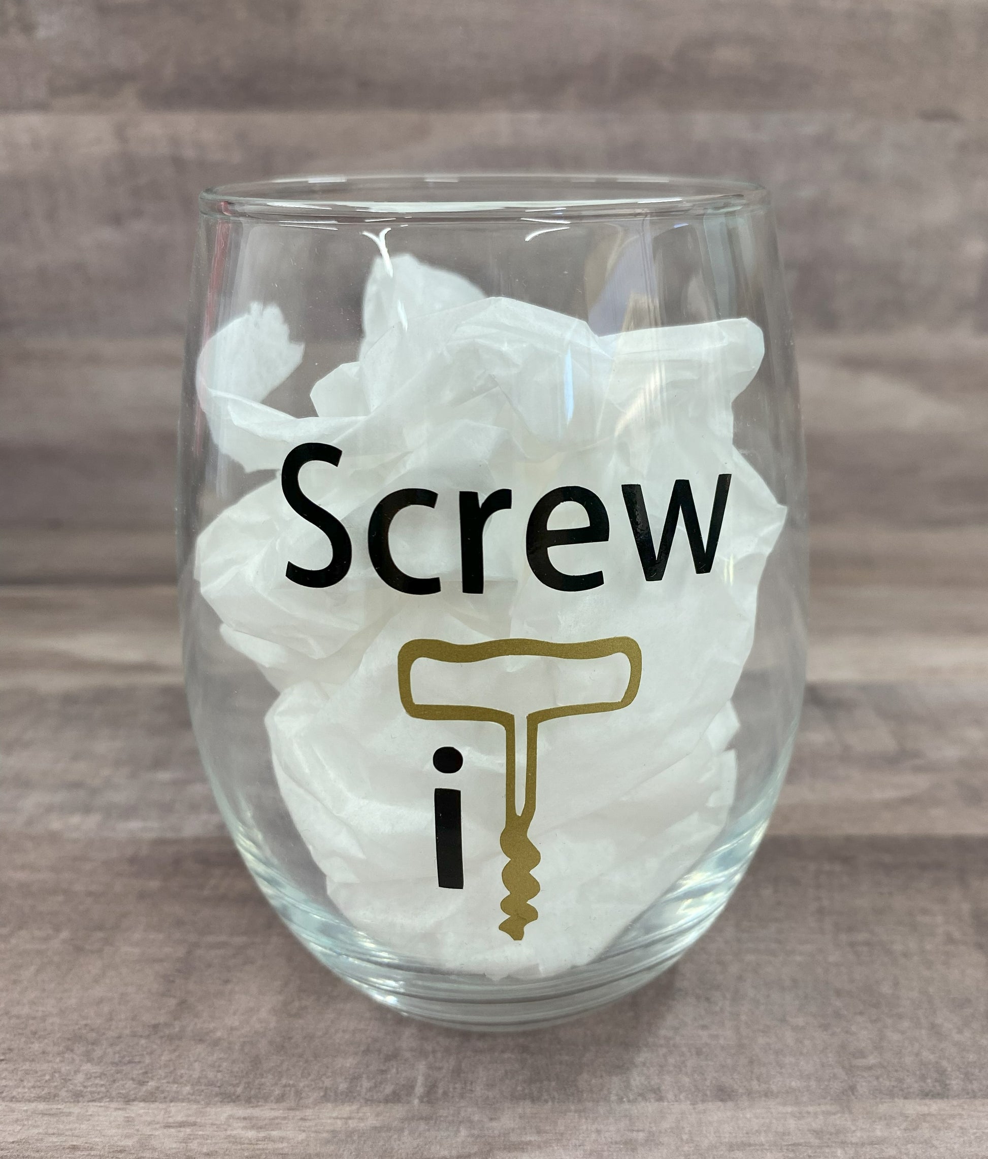 Stemless 15oz wine glass with the phrase screw it in black writing with the it as a graphic of a cork opener in gold Customizable. Designed by Grit City Rebel.