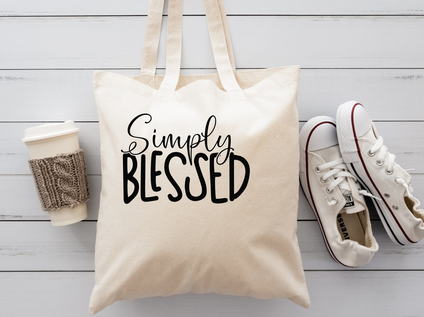 Cream cloth reusable tote with the saying Simply Blessed in black