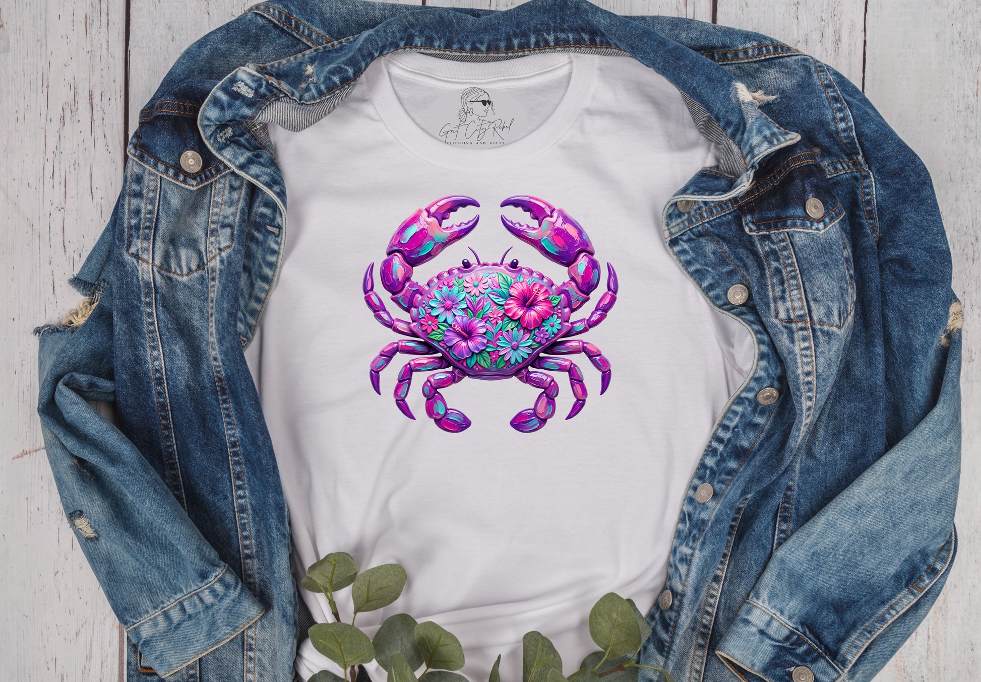 Grit City Rebel white unisex t-shirt with a purple pink crab with flowers on the shell. Available in sizes small to 3xl. 