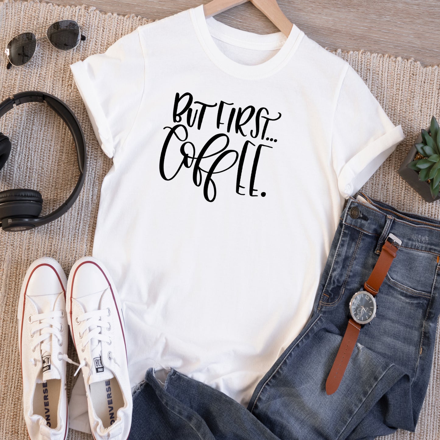 White short sleeve unisex TShirt, with the saying But First Coffe in black vinyl