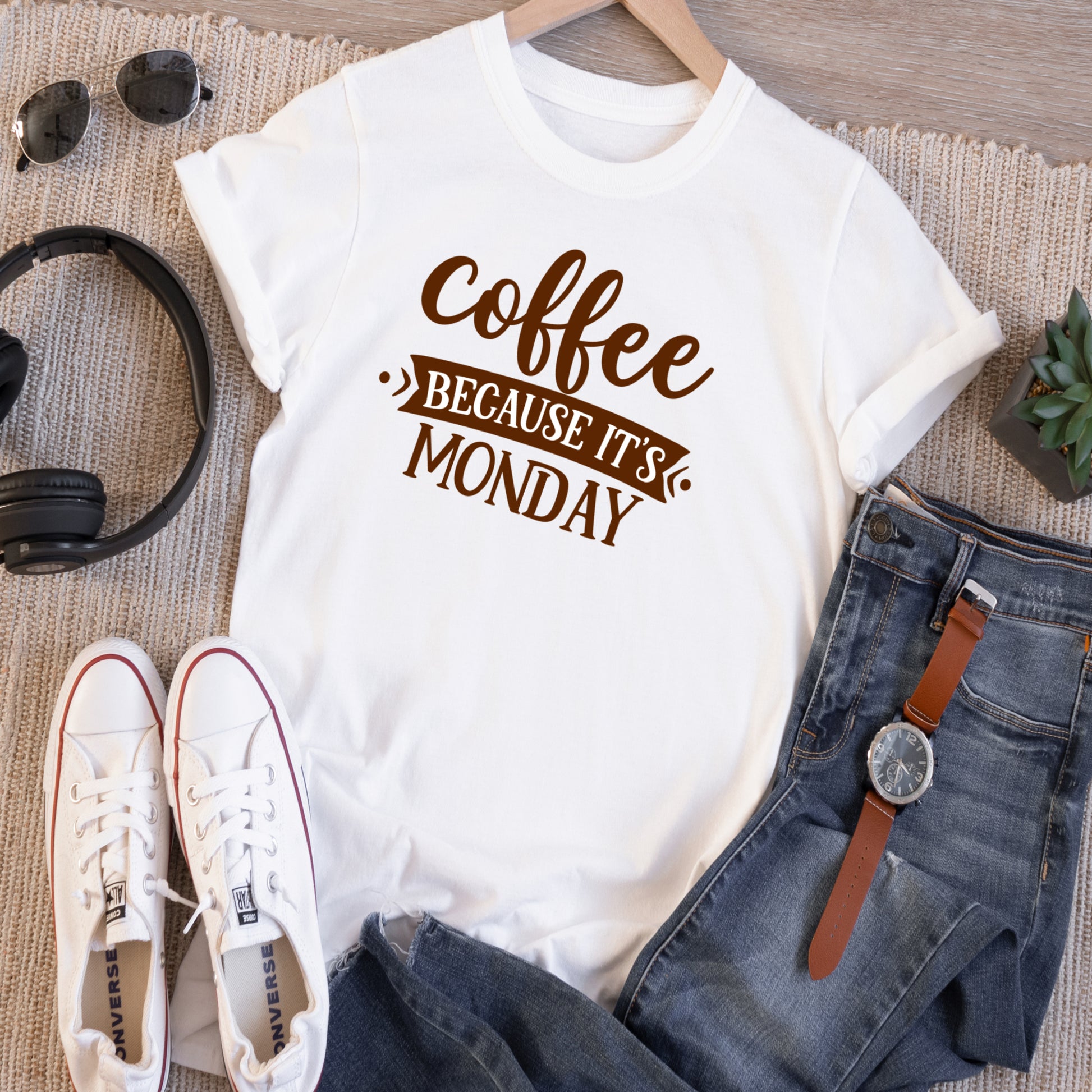 White short sleeve unisex tshirt with the saying Coffee Because it's Monday in brown writting