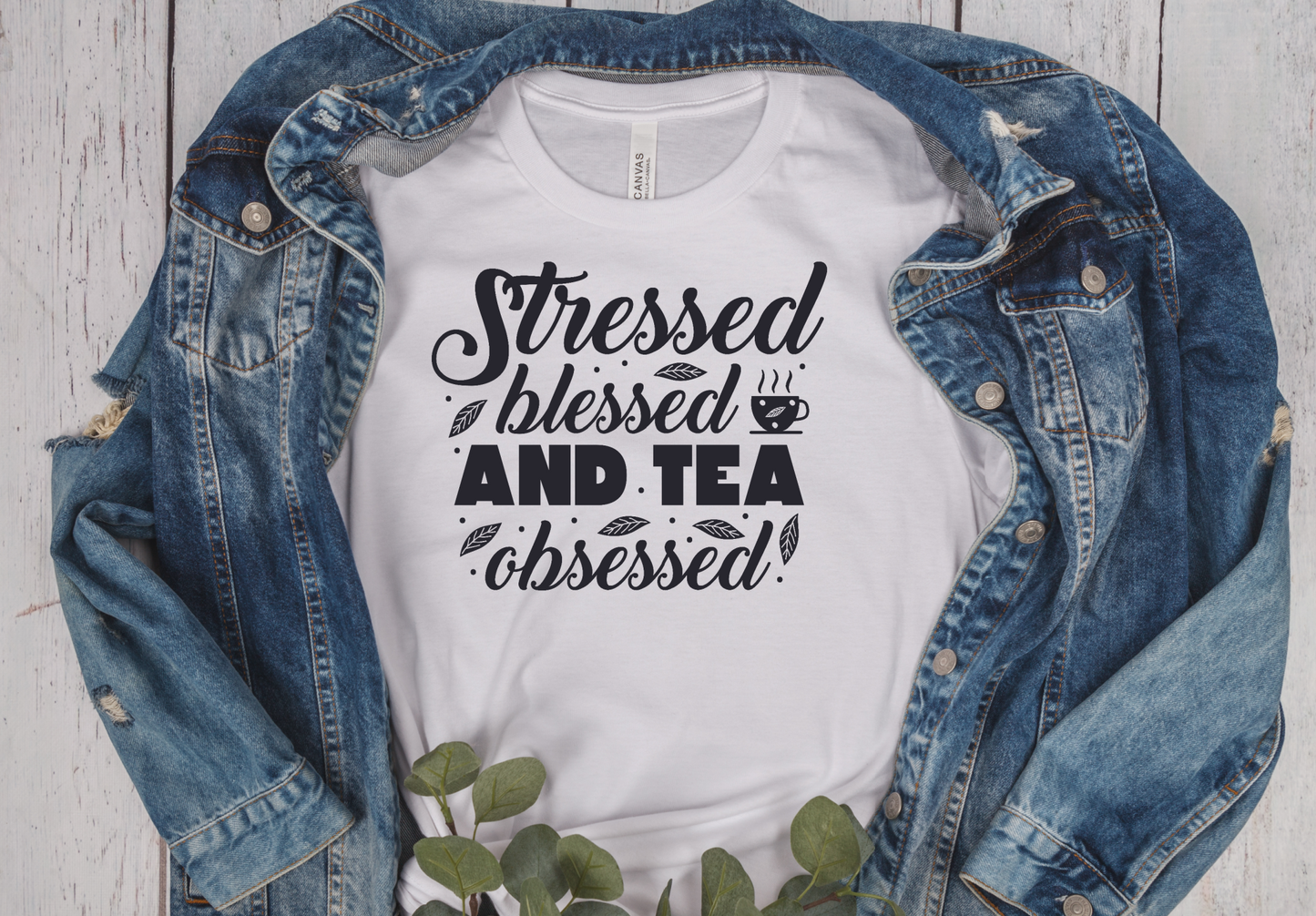 white short sleeve unisex T-Shirt with the saying Stressed Blessed and tea obsessed in black writting