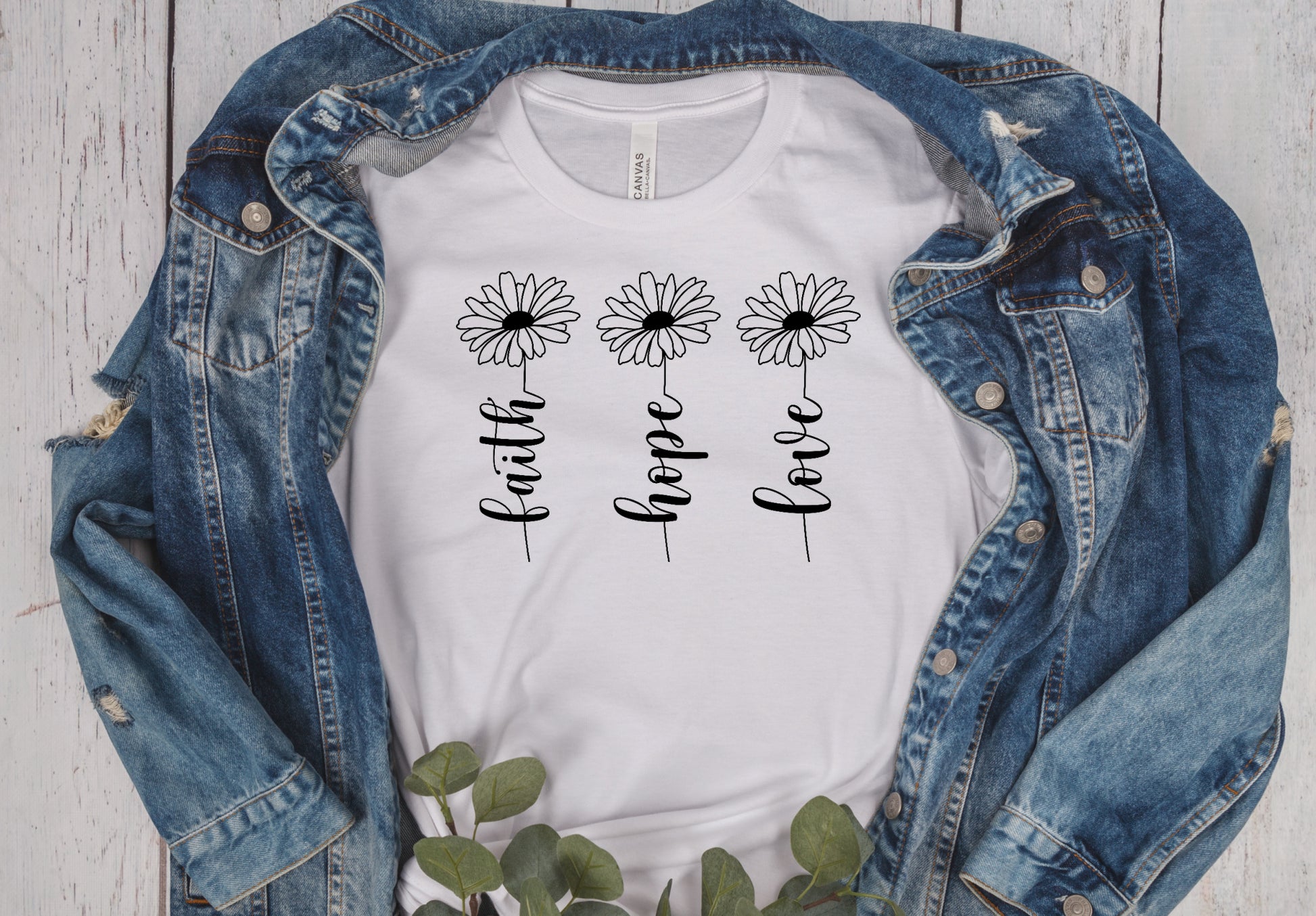 white unisex short unisex T-Shirt with 3 flowers that say faith, hope, love on the stems