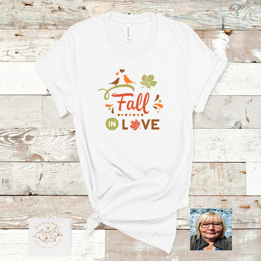 White TShirt with the saying Fall in Love in green and orange corols, Grit City Rebe