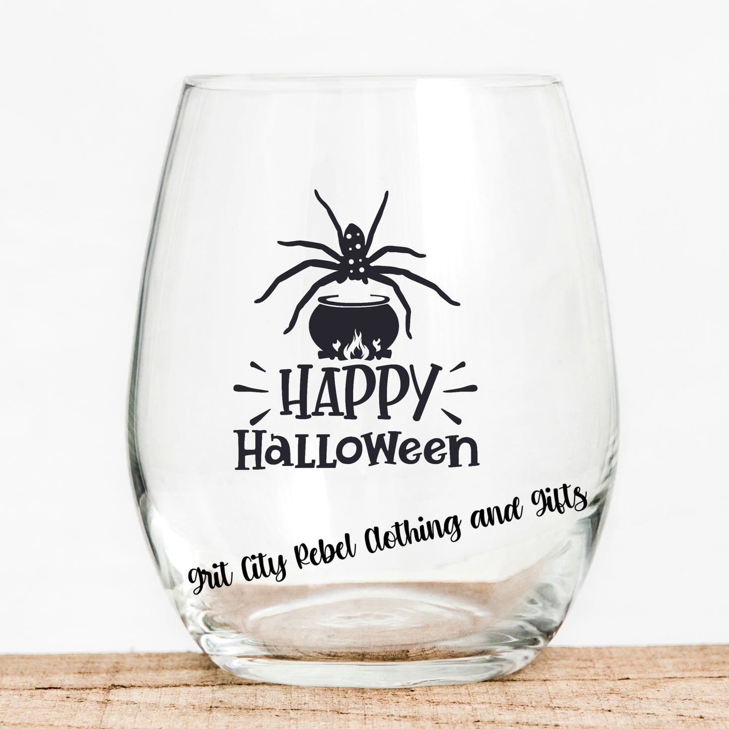 15oz Wine glass with the saying Happy Halloween with spider in black writing Grit City Rebel