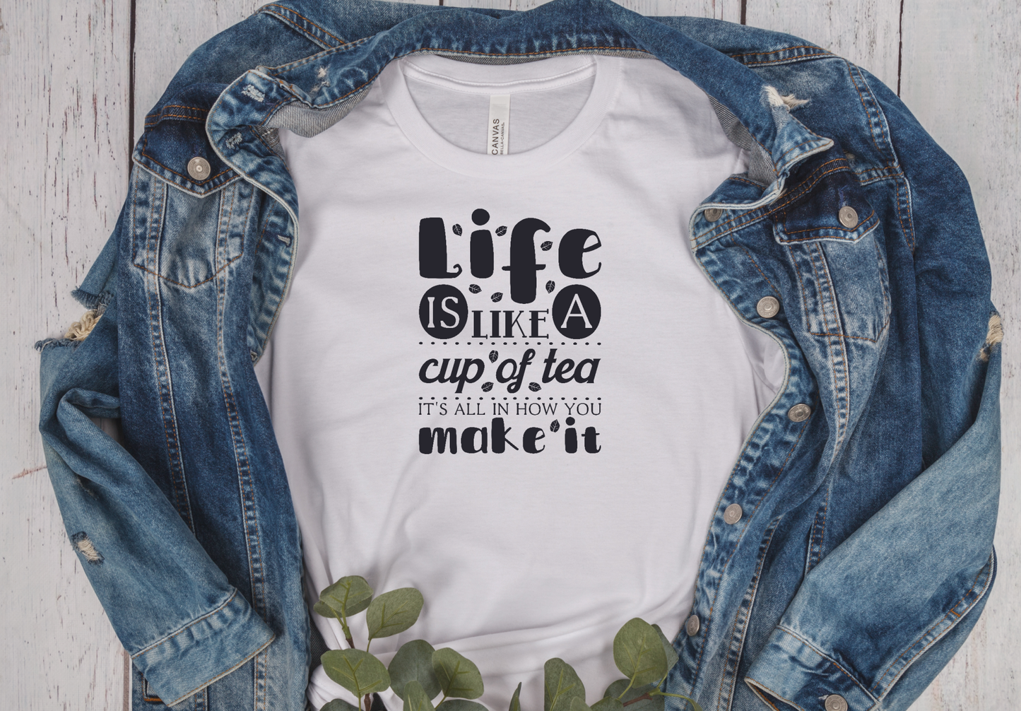 white unisex fit T-shirt with the saying Life Is Like A cup of tea it's all in how you make it in black writting
