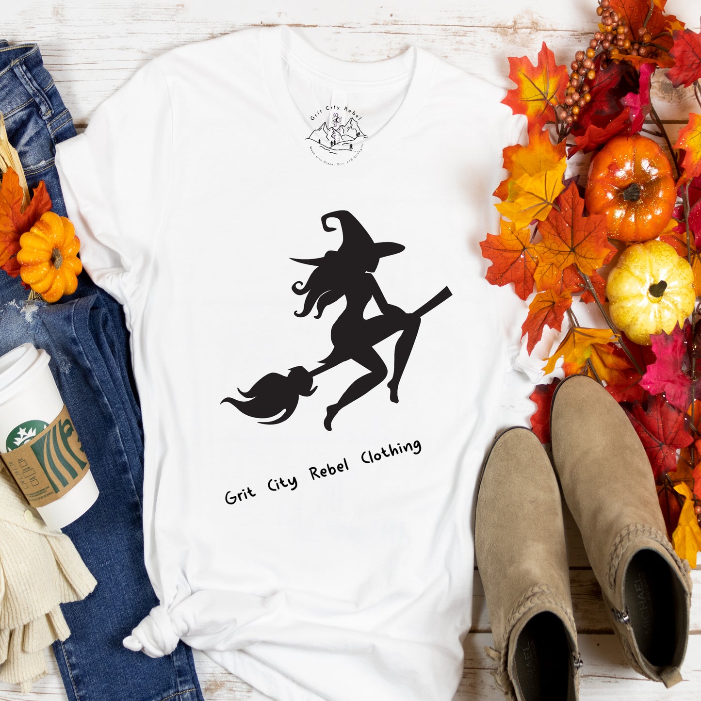 Witch on a broom stick in black on a white unisex TShirt