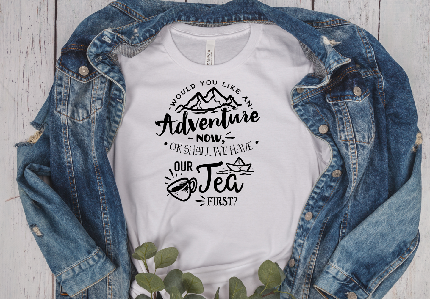 white short sleeve unisex fit T-Shirt with the saying would you like an adventure now or shall we have our tea first in black writting