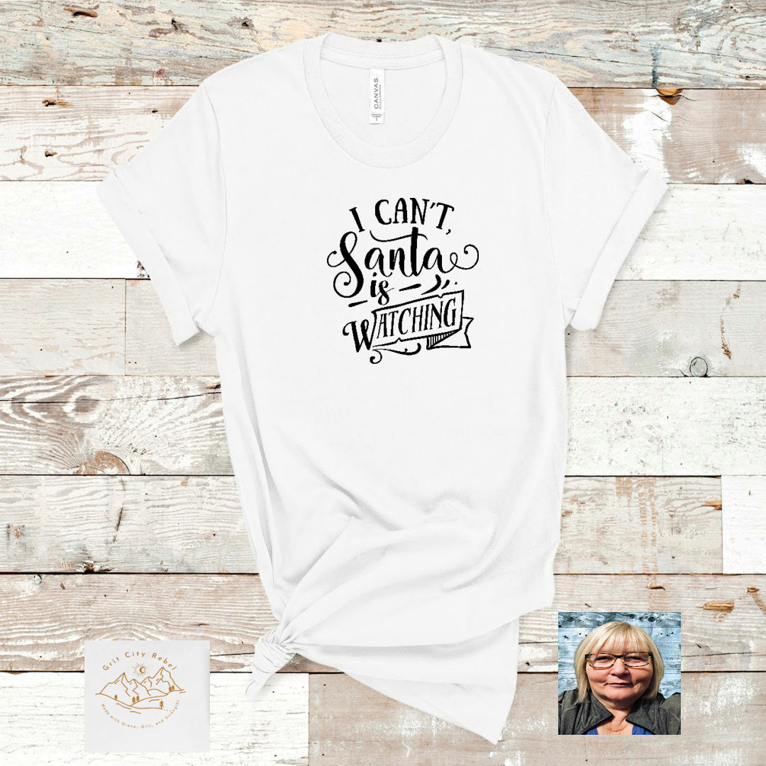 Christmas white unisex T-Shirt in sizes Small to 3X with the saying "I can't Santa is watching"