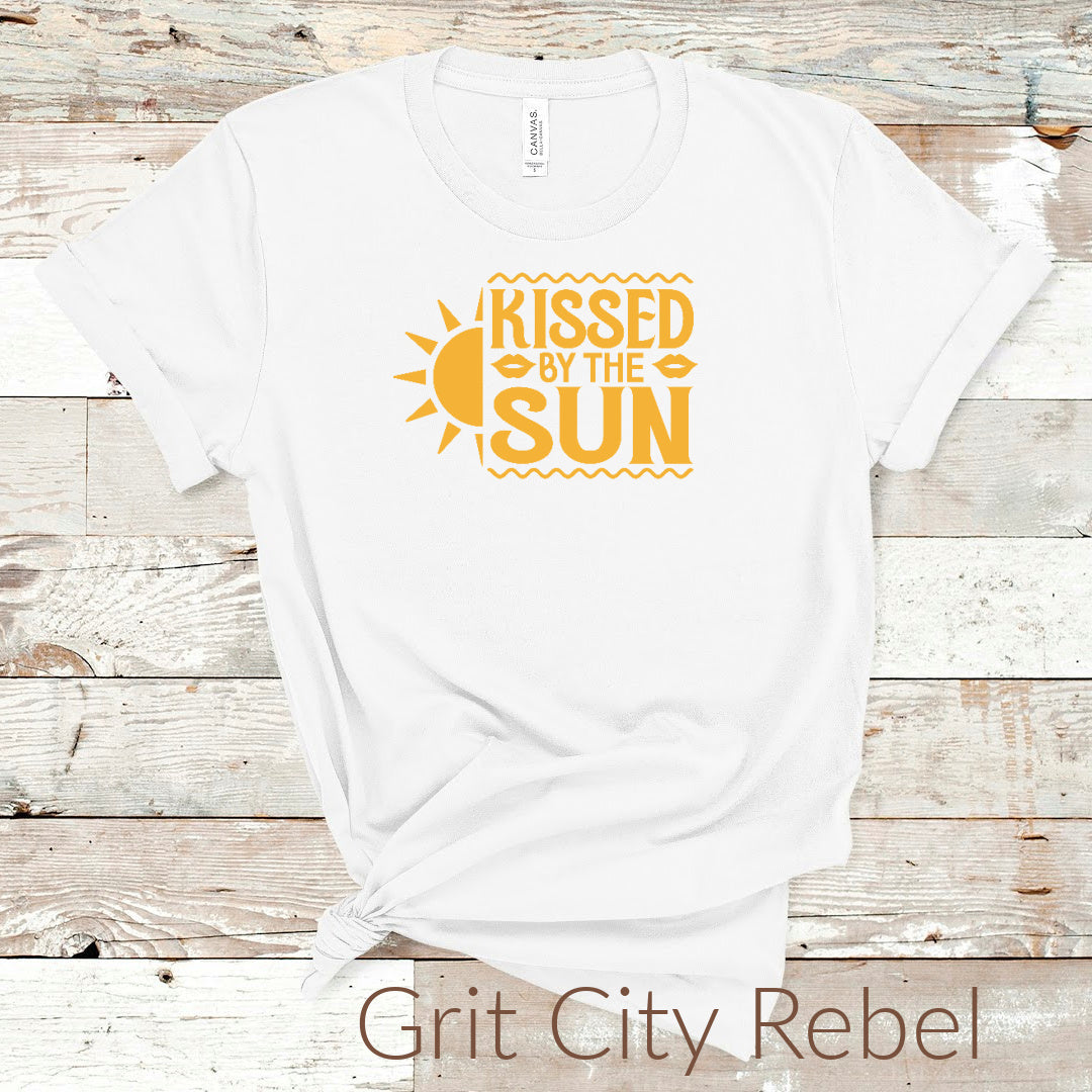 White T-Shirt with the saying Kissed By The Sun in a yellow golden color