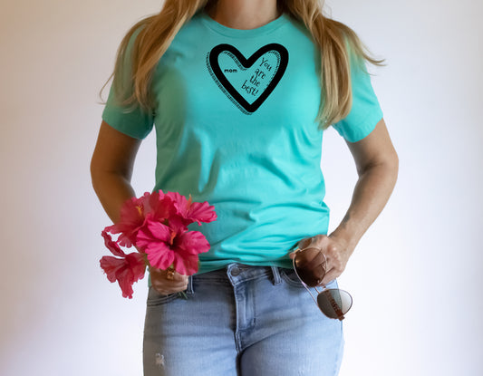 Turquoise unisex short sleeve T-Shirt with a black heart and the saying inside mom you are the best.