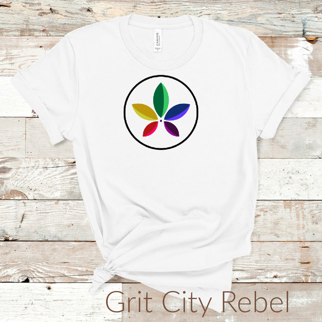 Pride flower Shirt. White Shirt with Rainbow Petals. Comes in unisex sizing. Small to 3X.LGBTQIA2+